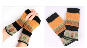 Detailed knit texture of orange and green Christmas tree pattern fingerless gloves