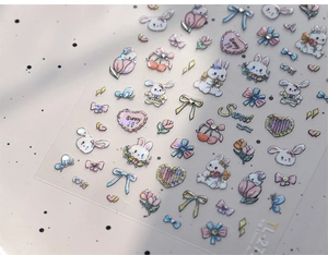 Macro shot of 3D embossed cartoon rabbit nail stickers with laser metallic luster finish
