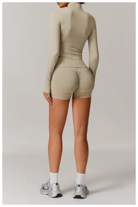 Rear view of light khaki seamless yoga set showing scrunch butt detail and high-stretch fabric