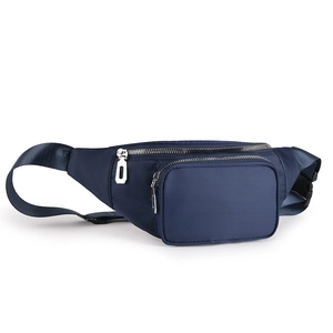Detail view of navy blue nylon waist bag showing multi-layered silver metal zippers