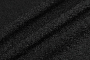 Close-up of black mesh fabric showing high-density texture and elegant matte finish draping