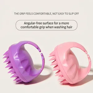 Ergonomic silicone scalp massager brush in pink and purple colors for hair washing