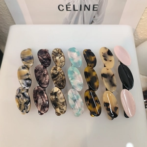 Three-link acetate oval geometric hair clips in various marble and tortoiseshell patterns