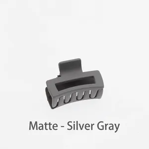 Close-up of matte silver gray hollow square hair claw clip with frosted texture