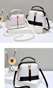Detail of Boston-style handbags with gradient macaron colors and metal zip closure