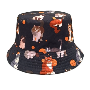 Detailed view of feline print patterns and stitched brim on the cotton sun hat