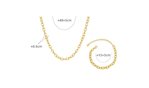 Detail view of gold thick chain necklace and bracelet set with S.STEEL material tags
