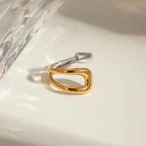 Modern two-tone 18k gold and stainless steel asymmetric open ring with crossover design