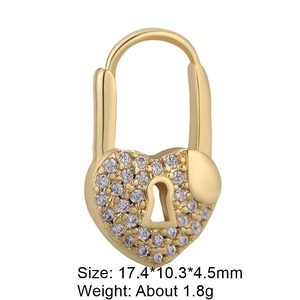 Macro detail of gold-plated heart lock pendant with cubic zirconia inlay for DIY jewelry
