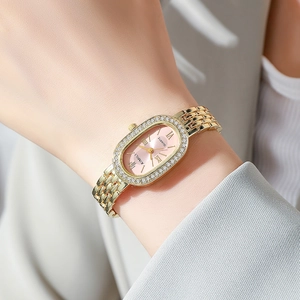 Elegant rose gold women's watch with oval pink dial and crystal-set bezel decoration