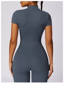Detailed back view of sleek slate blue zip-up yoga bodysuit with V-seam waist