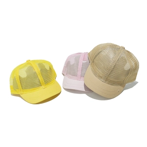 Three breathable mesh trucker hats in yellow, pink, and khaki colors for outdoor sun protection