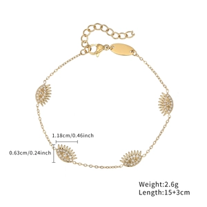 Gold evil eye bracelet with four zircon-encrusted charms and size measurements