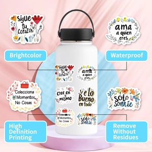 Detail of waterproof Spanish motivational stickers applied on a white sports bottle