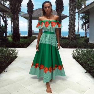 Off-the-shoulder green and white striped swimsuit with tropical floral pattern detailing