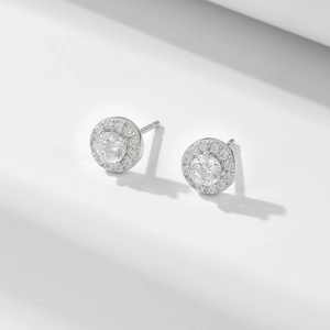 Classic round halo silver stud earrings with sparkling cubic zirconia on geometric stands