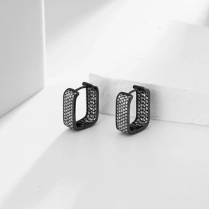Macro view of black square hoop earrings with pave-set white cubic zirconia stones
