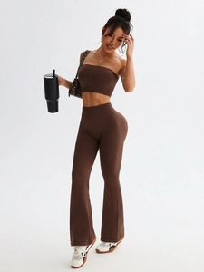 Close-up of brown high-waisted flare yoga pants with seamless fabric texture and fit