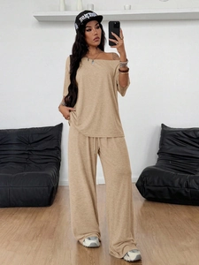 Women's chic beige two-piece lounge set with off-shoulder top and wide-leg knit trousers