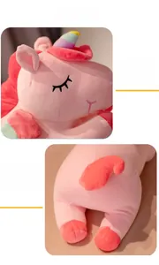 Close-up of pink unicorn plush toy with rainbow horn and detailed electric embroidery
