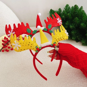 Detailed view of red and yellow Christmas reindeer antler headbands with sequins