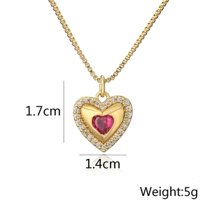 Macro view of heart pendant with red stone and dimensions showing 1.7cm and 5g weight