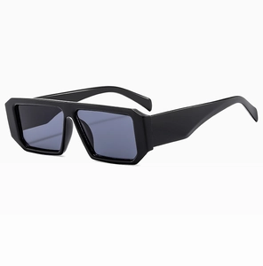 Detail shot of vintage rectangular sunglasses with thick black frames and dark blue lenses