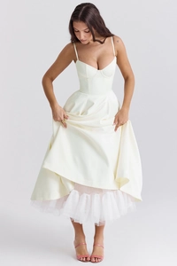 Detailed close-up of cream white French style dress with double straps and lace mesh skirt