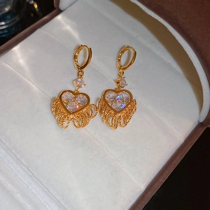 Luxurious gold-plated heart-shaped dangle earrings with sparkling zircon gemstones