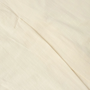 Macro view of light beige linen fabric texture with detailed stitching and natural folds