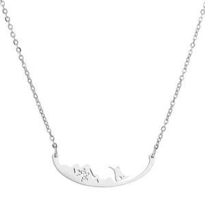 Minimalist winter snowflake and skier pendant necklace in polished silver finish