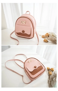 Detail of pink and brown mini backpack with gold bow and magnetic snap closure