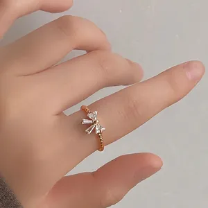 14K gold plated bow ring for women with micro-set zircon stones in a wave textured band