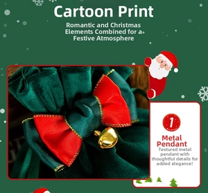 Detail of green velvet Christmas gift bag with red satin ribbon bow and gold bell charm