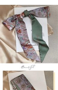 Detail of silk hair scarf with oil painting pattern and 'love you' embroidery