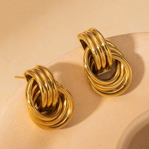 Minimalist gold knot earrings with triple circular interlocking design in polished steel
