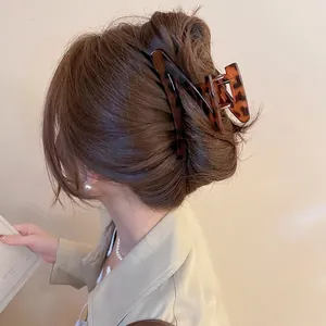 Elegant tortoiseshell Z-shaped hair claw clip for women in a vintage amber resin finish
