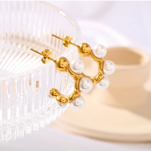 Elegant gold-plated C-shaped titanium steel earrings inlaid with white pearls for women