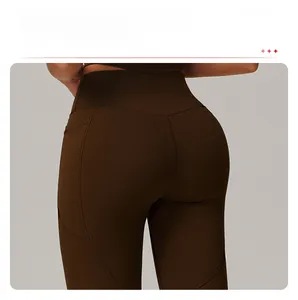Detail of high-waisted yoga leggings showing butt-lifting seams and matte elastic fabric