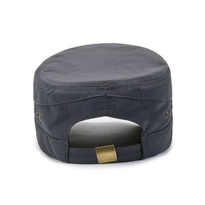 Detail of adjustable metal buckle and breathable vents on the navy blue flat top cadet cap