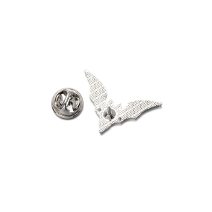 Detail showing the textured silver metal back and butterfly clasp of the bat brooch