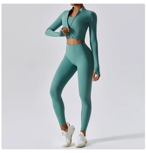 Three-piece yoga set with zip-up jacket, sports bra, and high-waisted leggings in soft green