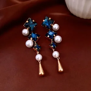 Vintage style drop earrings with blue crystal, round pearl and golden waterdrop pendant