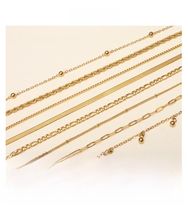 Detail of 18K gold plated stainless steel Cuban, rope, and snake chains in various sizes
