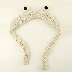 Cute beige handmade crochet frog ear warmer headband with big cartoon eyes design