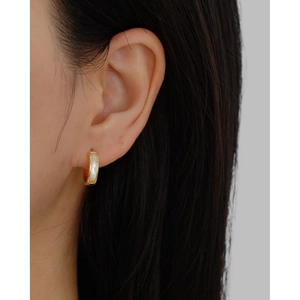 Elegant gold round hoop earrings with natural white mother of pearl inlay on model