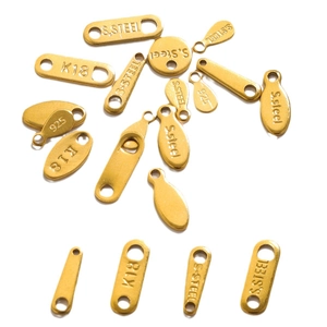 Golden stainless steel jewelry tags in round and oval shapes with S.STEEL and K18 stamps
