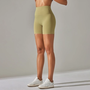 Side view of avocado green high-waisted fitness shorts with wide slimming waistband