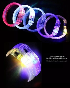Detail of LED glow bracelets with internal bubble texture and color-changing switch