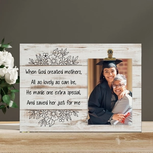 Detail of wooden Mother's Day photo holder with metal clip and sentimental English poem